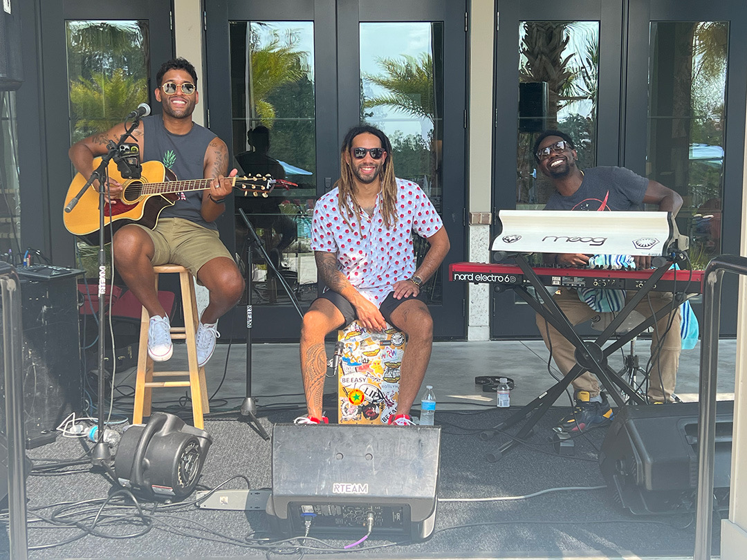 A live band performing at a Tributary community event