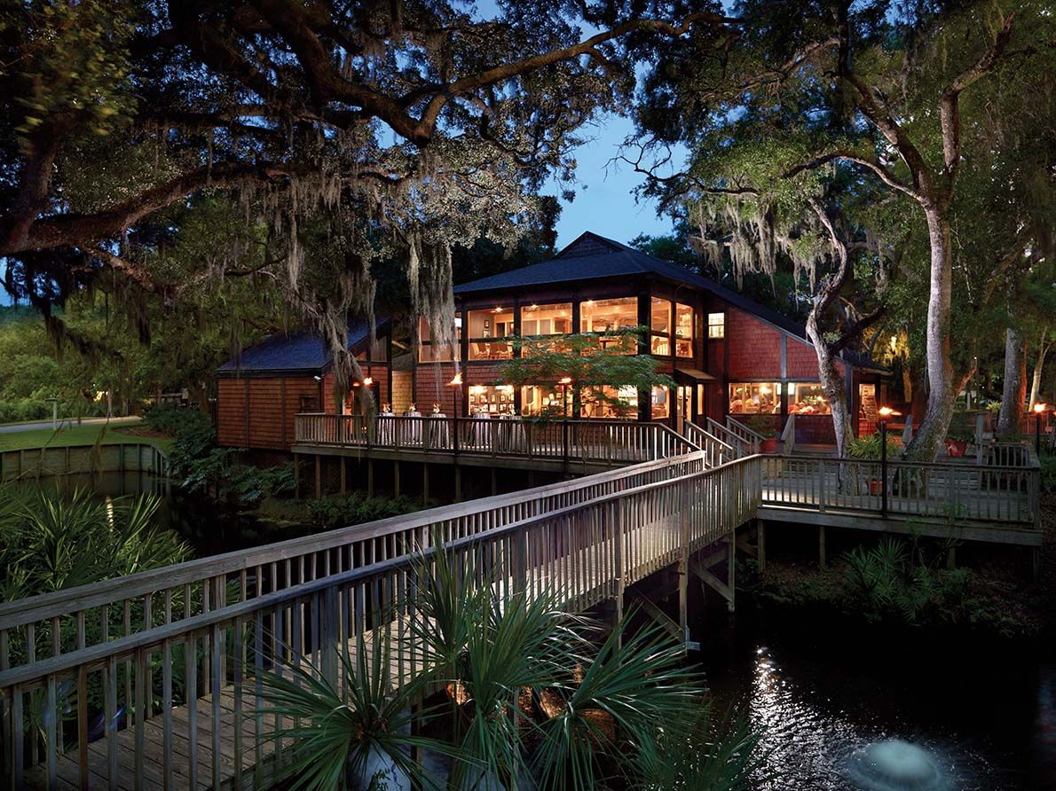 Waterfront restaurant deck near Tributary at dusk