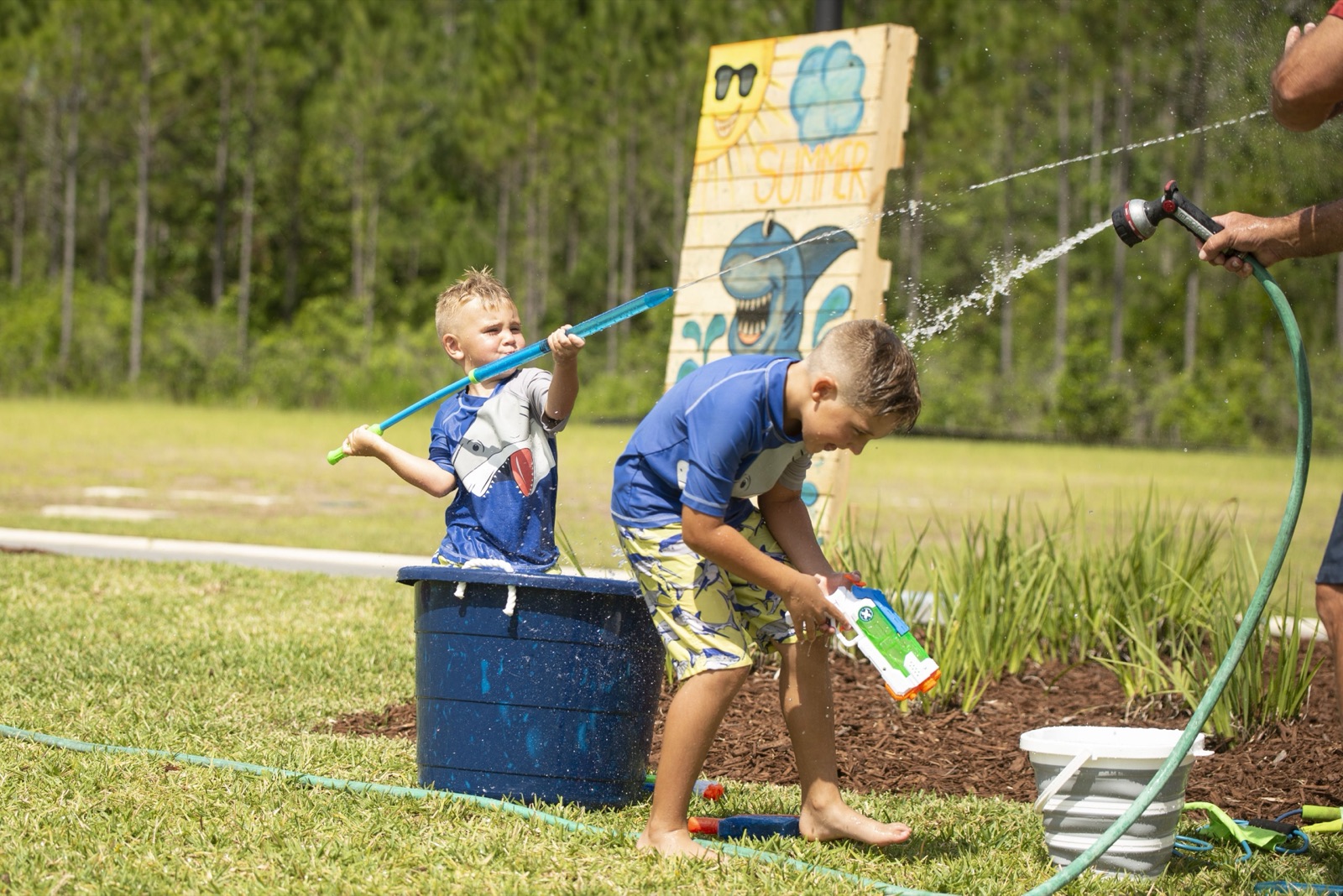 Kids playing with water at a Tributary community event