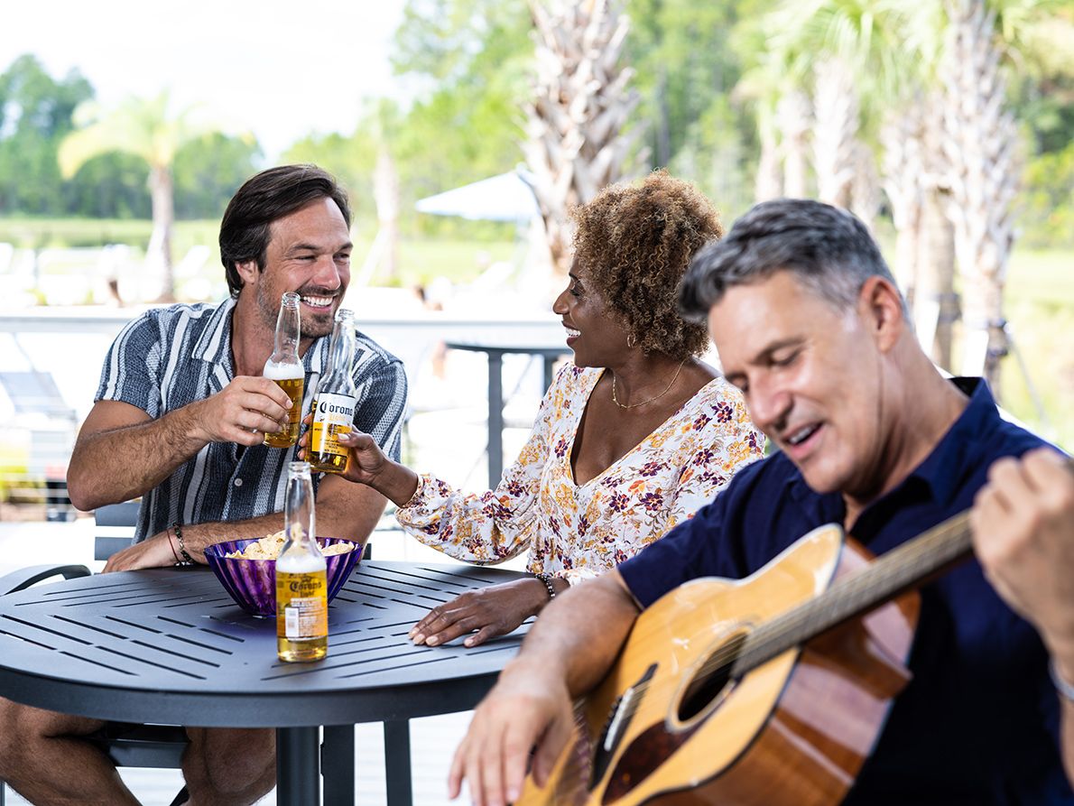 Friends enjoying music and drinks at Tributary