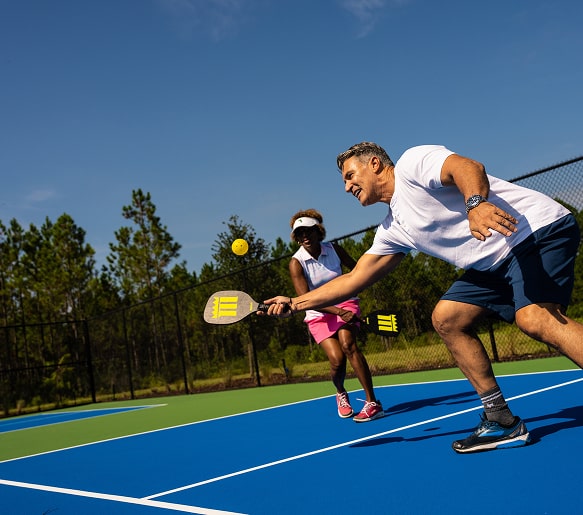Residents playing pickleball at the Tributary community courts in Nassau County, Florida