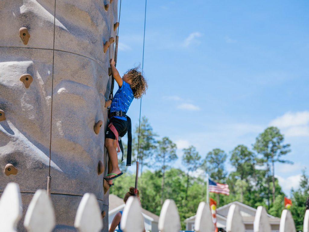 kid rock climbing at Tributary Model Home Event