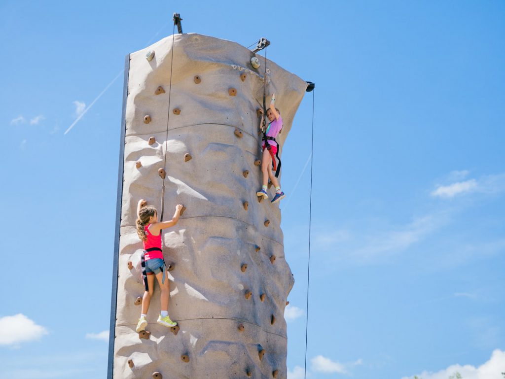 kids rock climbing at Tributary Model Home Event