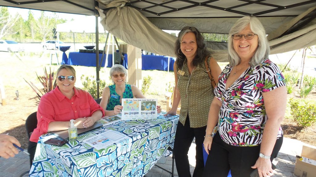 4 people smiling at Tributary Realtor Event