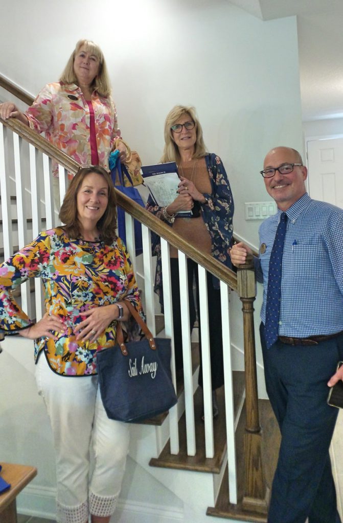 group of people touring a model at the Tributary Model Home Event
