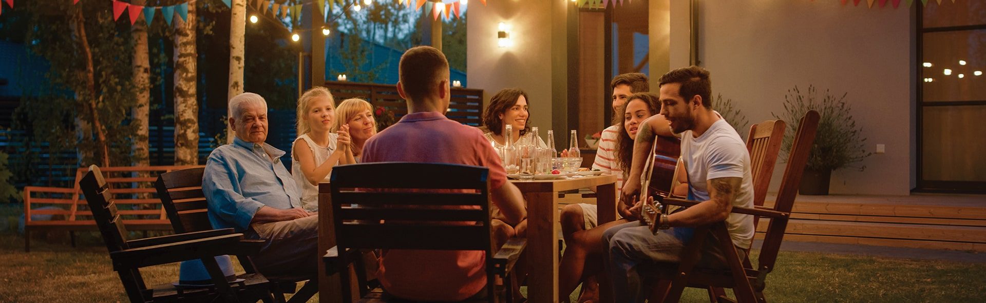 family gathered around a table at tributary