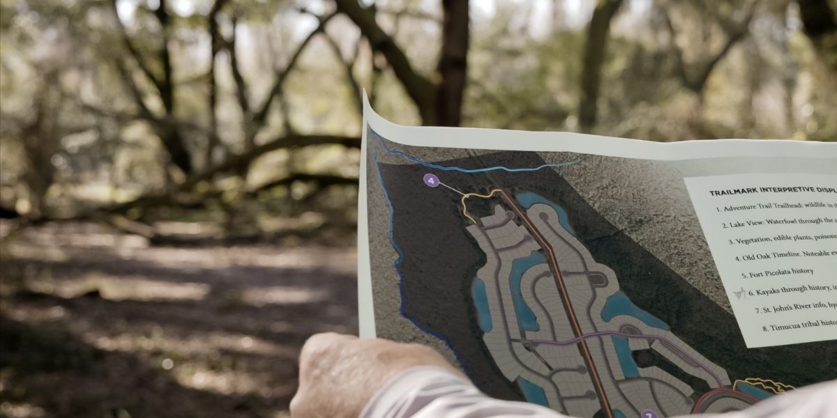 person holding a trail map 