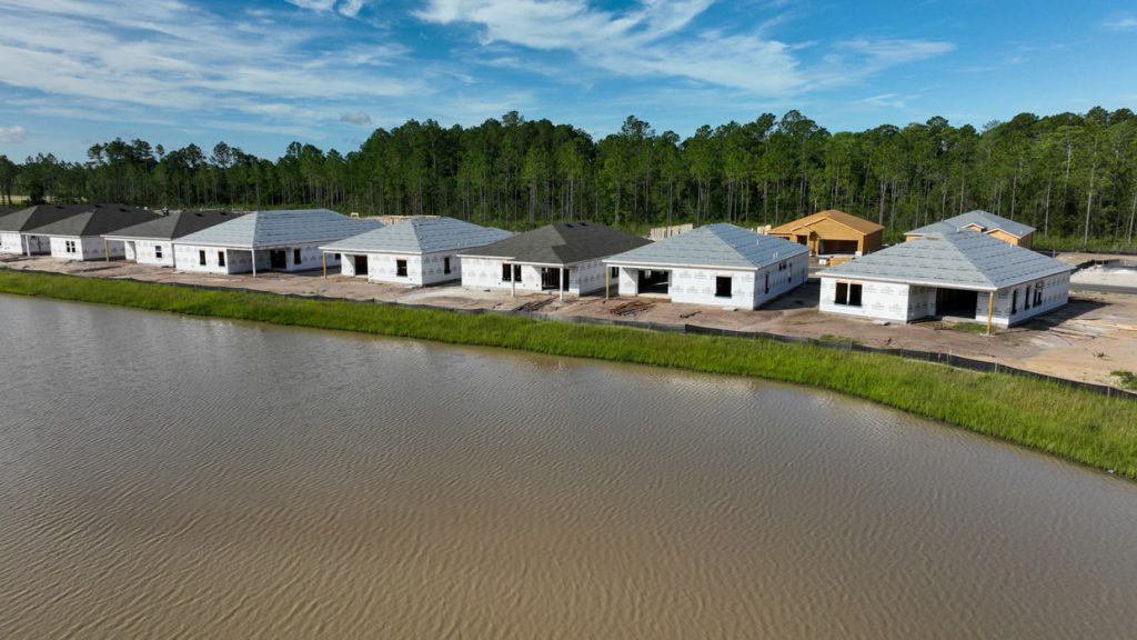 aerial of the lakefront home construction at tributary
