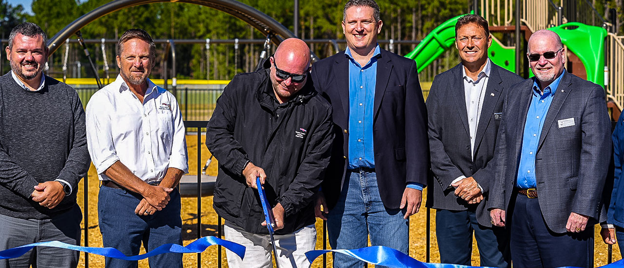 tributary developers cutting the ribbon at the regional park opening