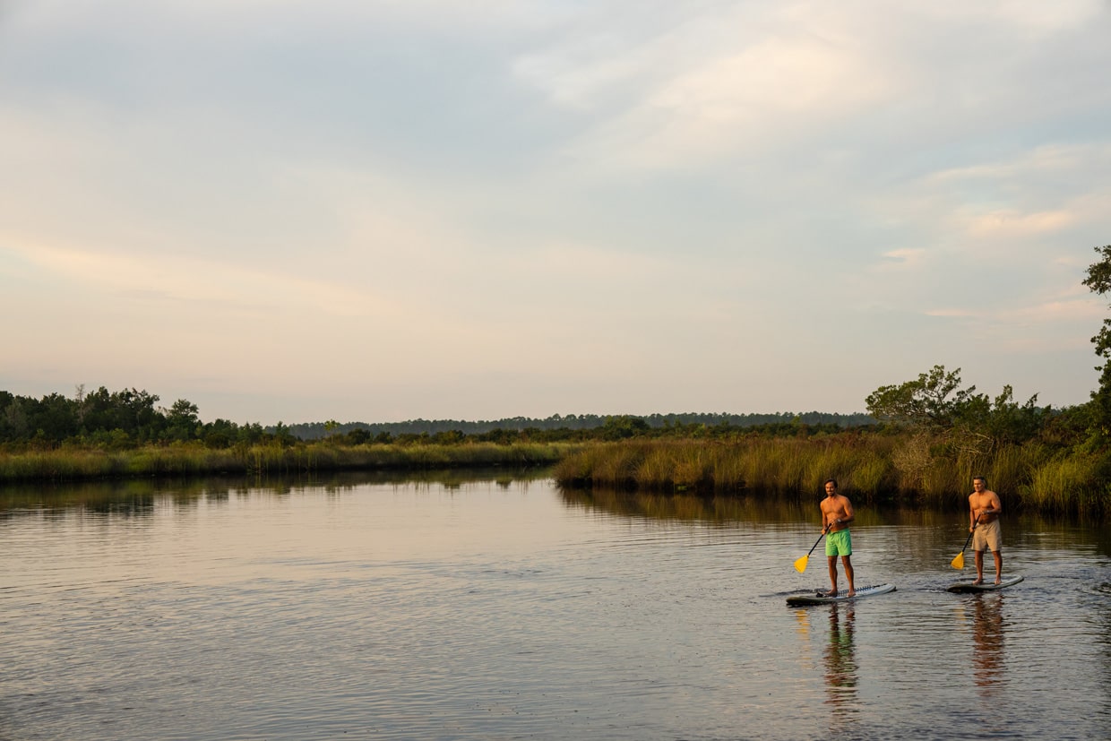 tributary residents paddle boarding