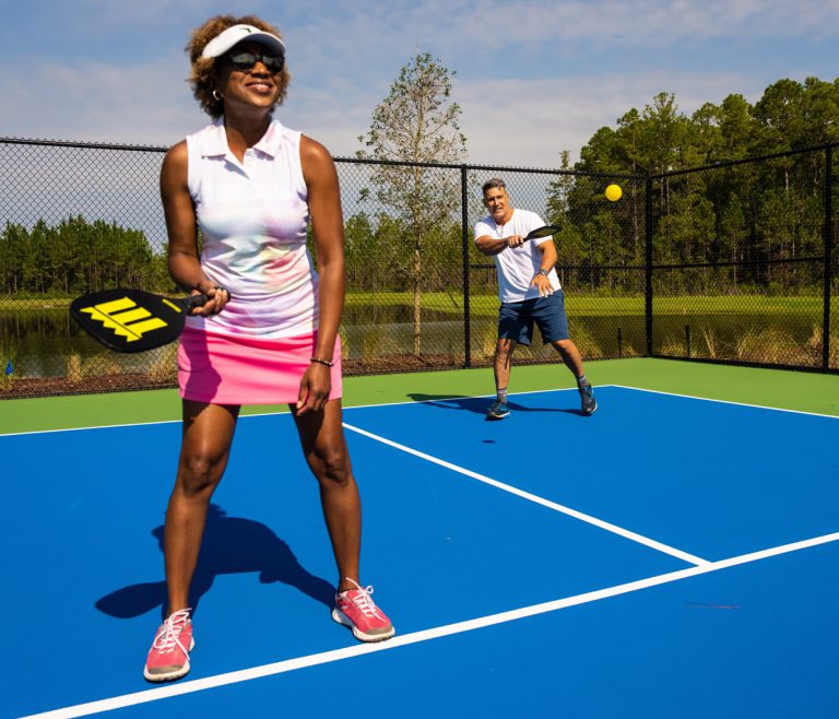 couple playing on the tributary pickleball courts