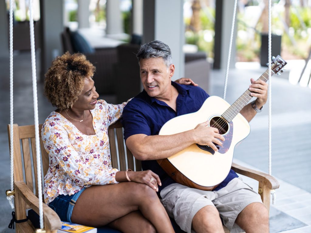 couple on the swing at amenity center