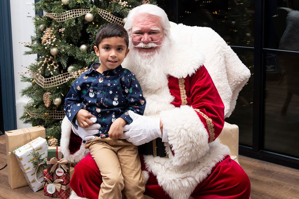 santa claus with families at tributary