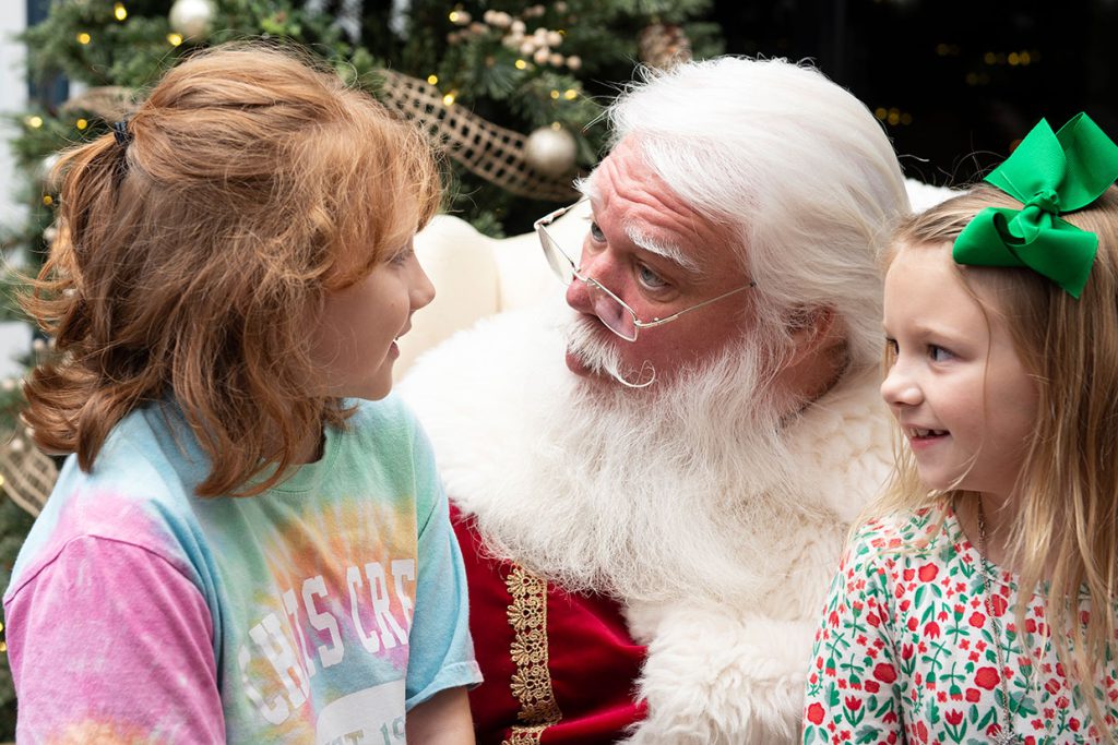 santa claus with families at tributary