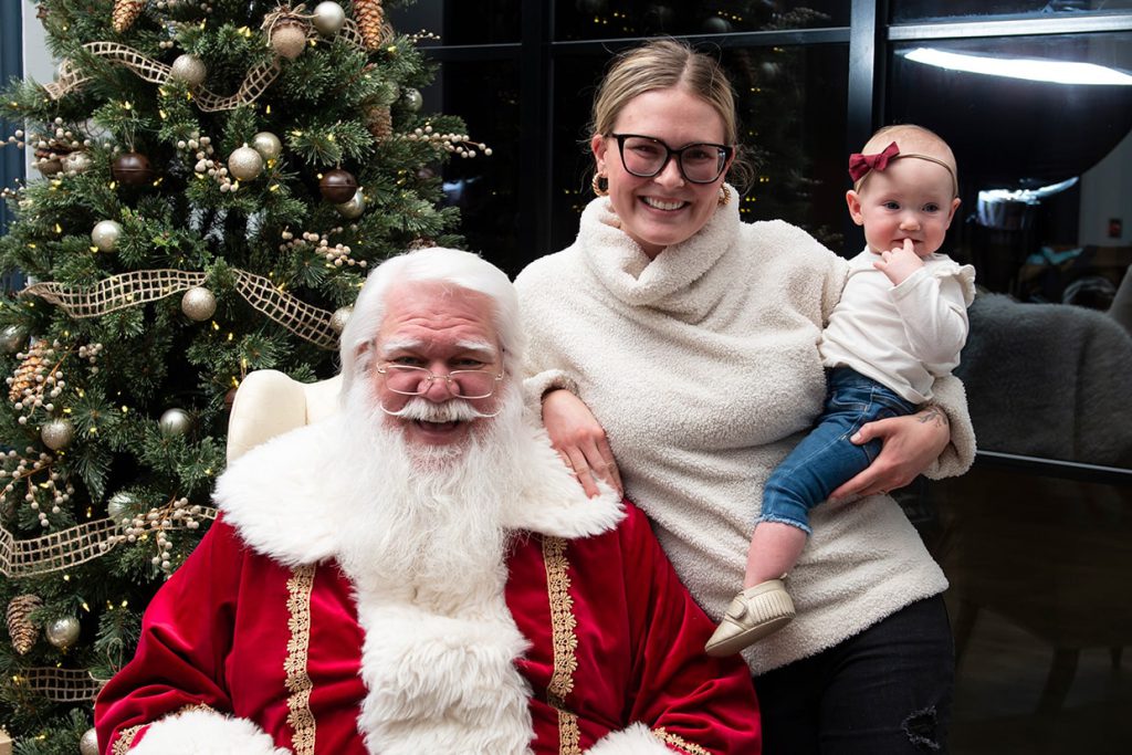 santa claus with families at tributary