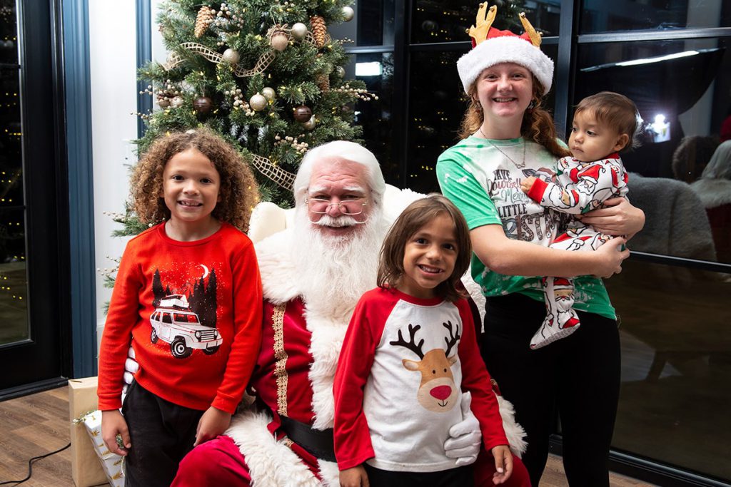 santa claus with families at tributary