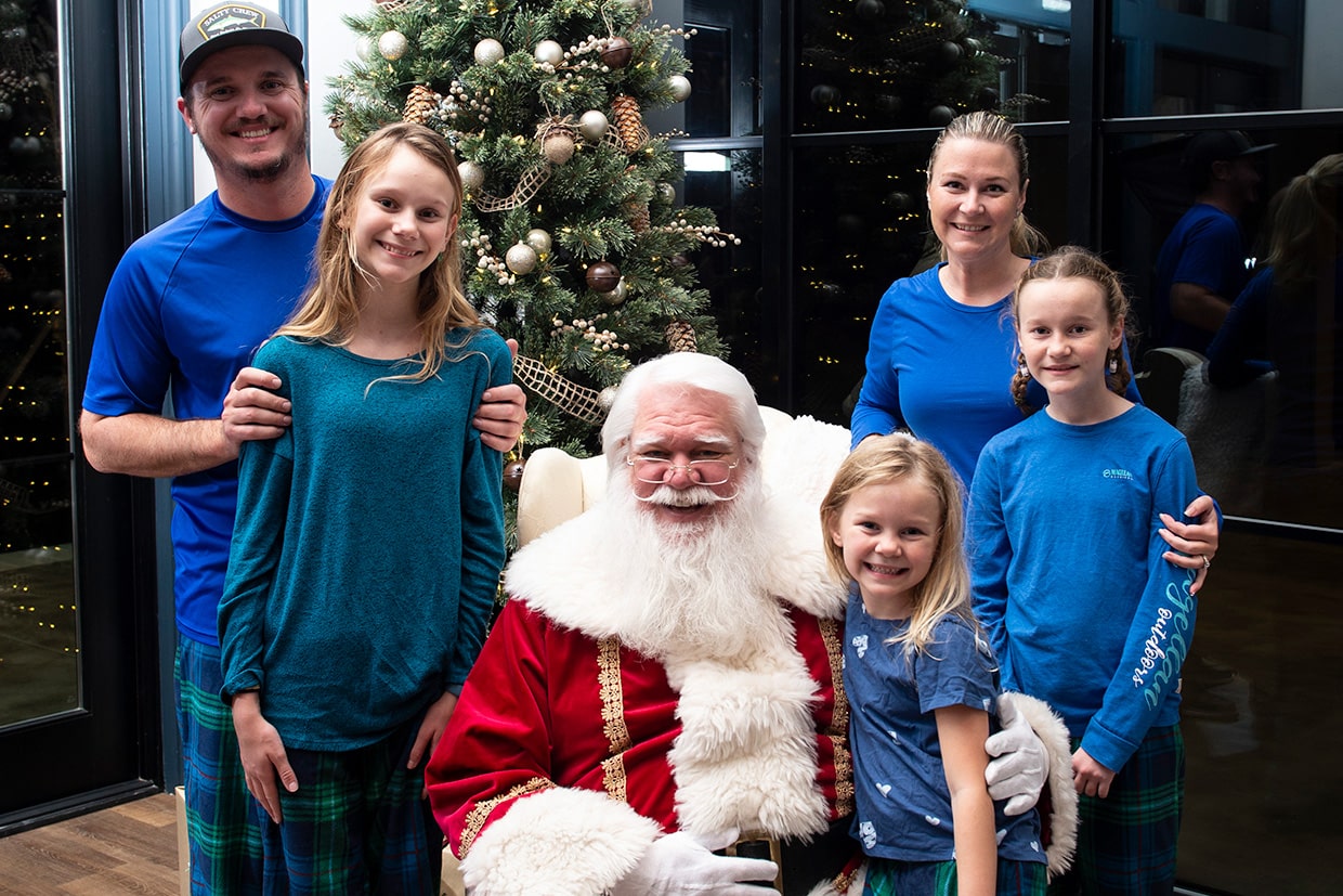 santa claus with families at tributary