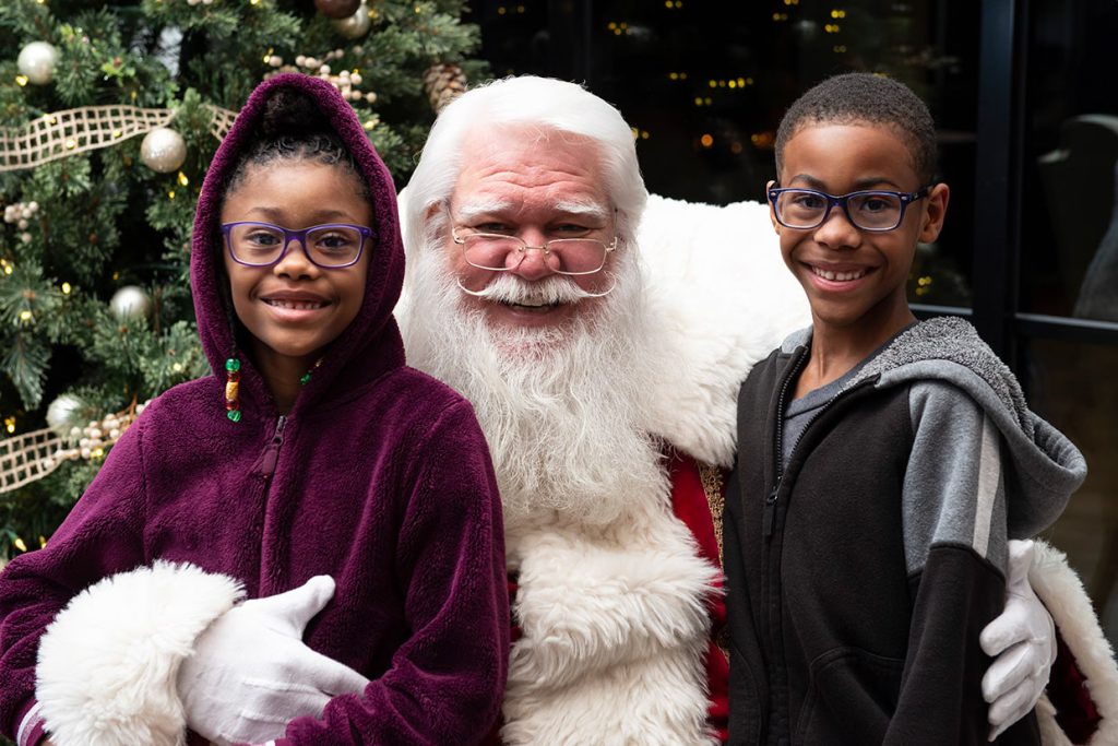 santa claus with families at tributary