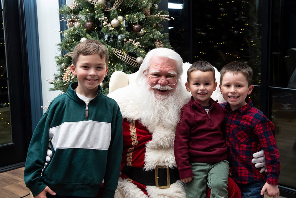 santa claus with families at tributary