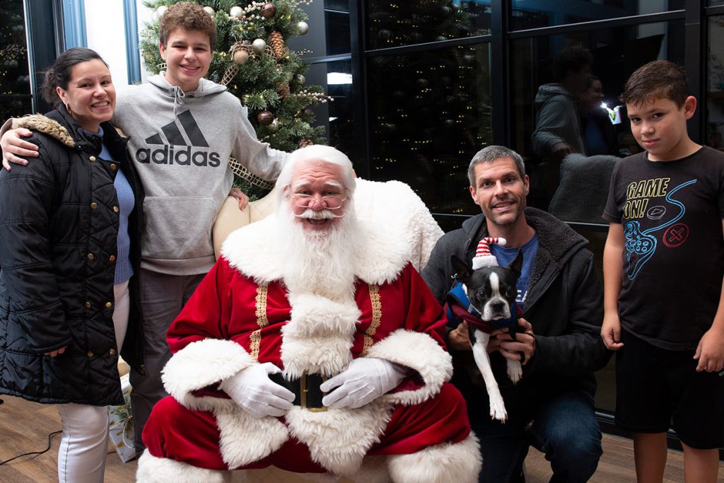 santa claus with families at tributary