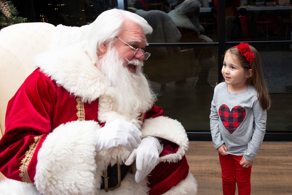 santa claus with families at tributary