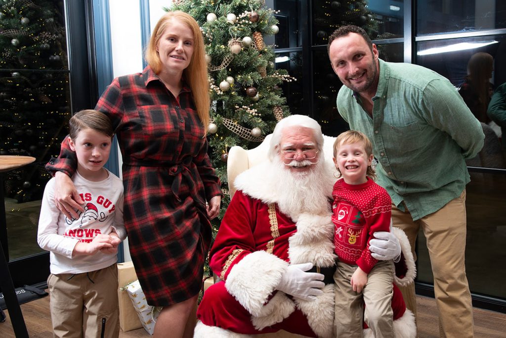 santa claus with families at tributary