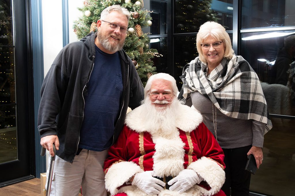 santa claus with families at tributary