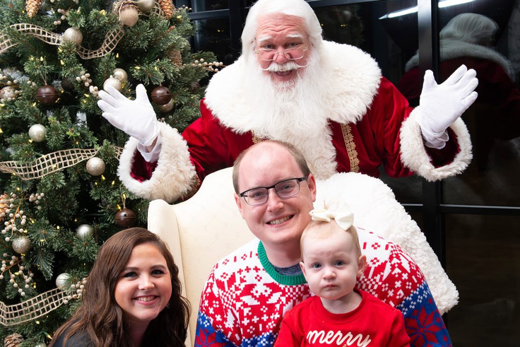 santa claus with families at tributary