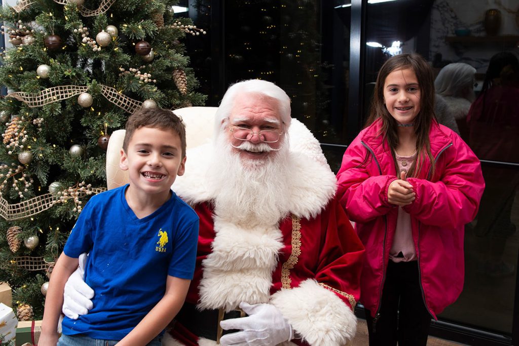 santa claus with families at tributary