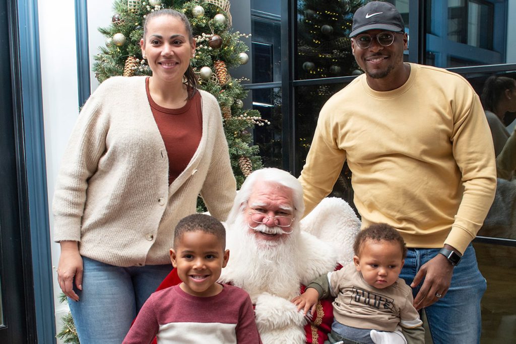 santa claus with families at tributary