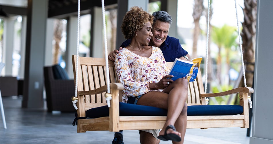 empty nesters on the swing at the amenity center