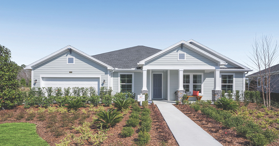 Single-story gray suburban home with garage and landscaped front yard