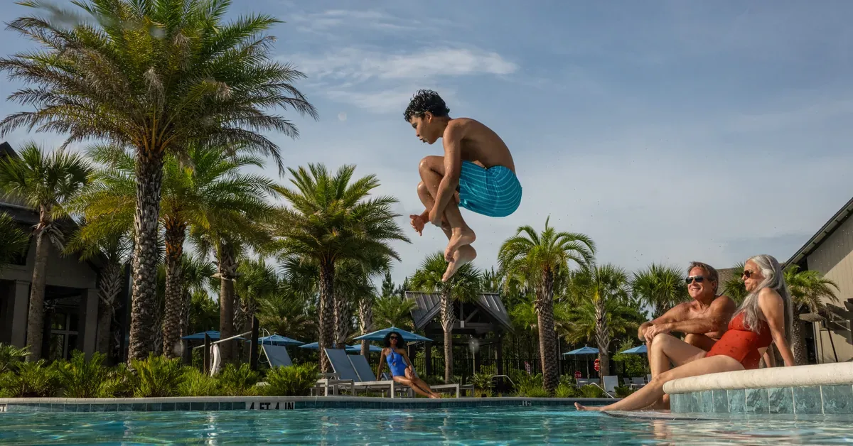 Boy Jumping In Pool Tributary